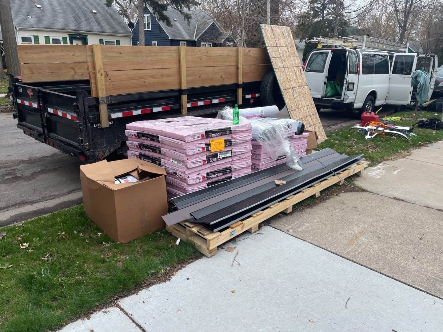 Owens Corning Duration shingles and materials staged for a Minneapolis, MN re-roof