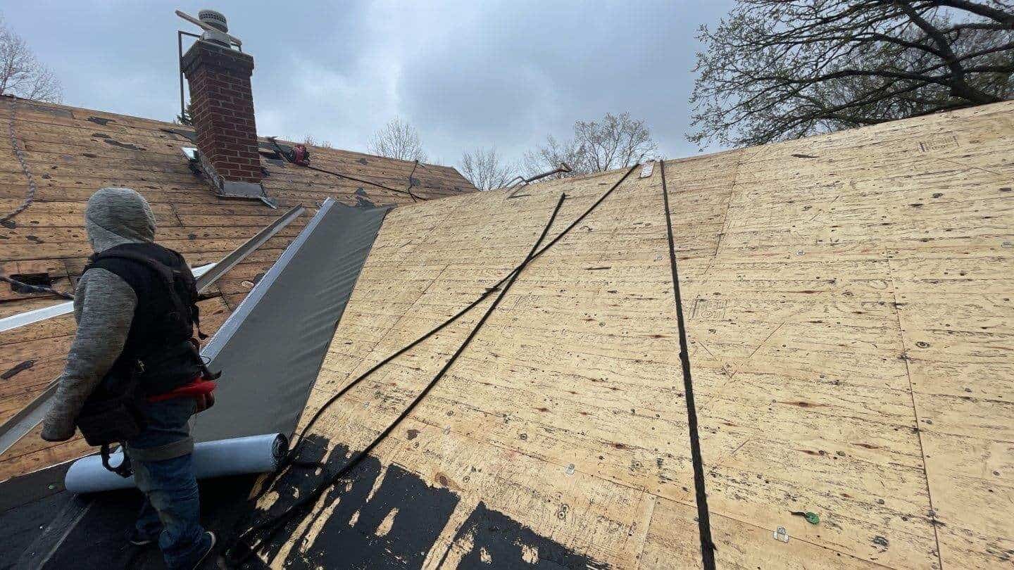 New underlayment going down on the roof deck of a Minneapolis, MN home