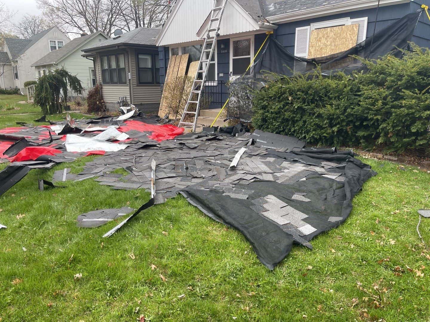 Tearing off the old roof on a Minneapolis, MN home
