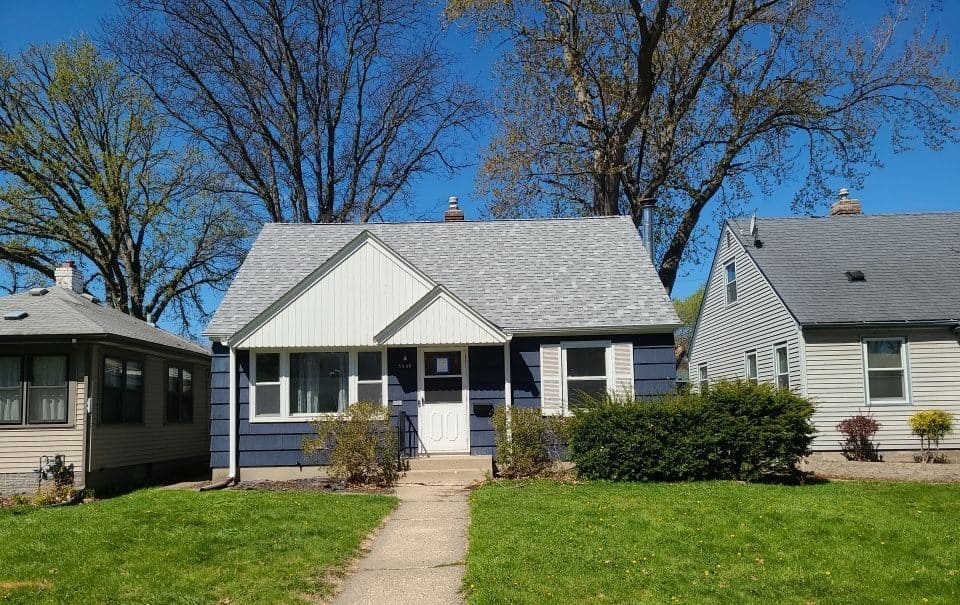 Front of a Minneapolis, MN home before its roof replacement