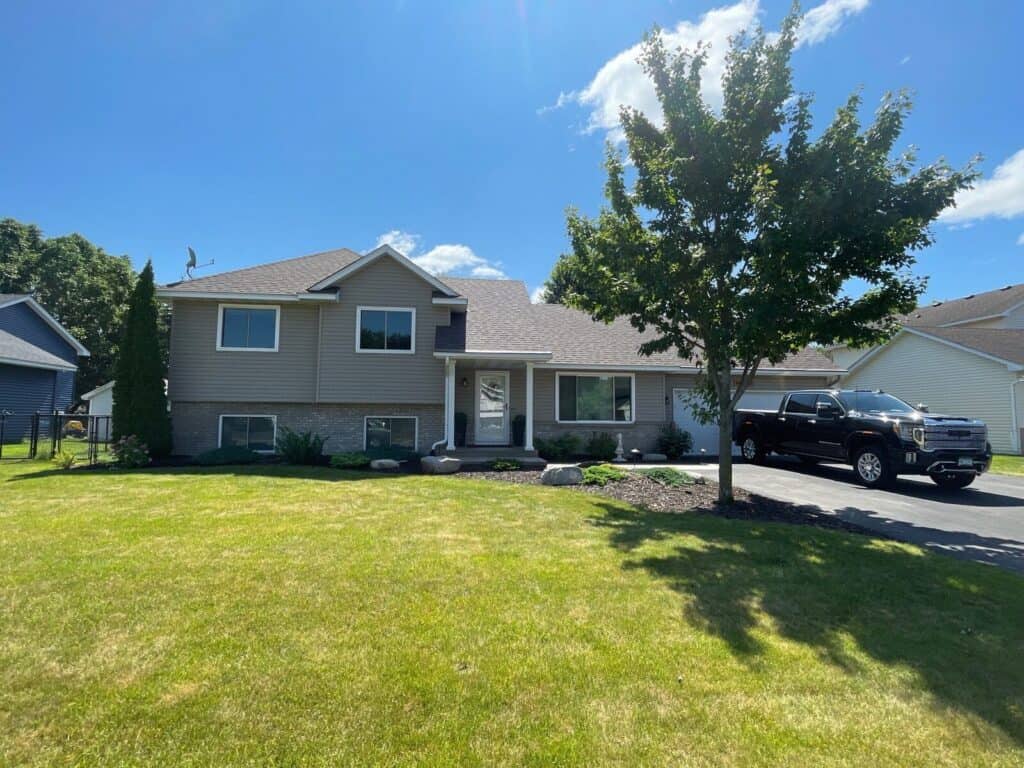 Andover, MN home after a hail damage roof replacement with Owens Corning Duration shingles in Teak