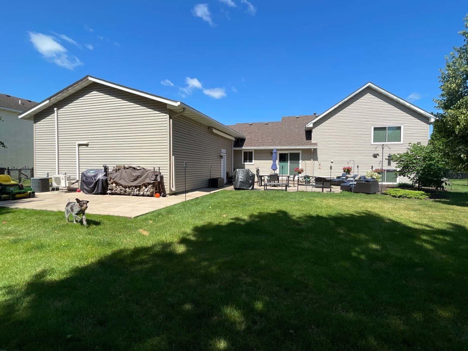Backyard view of an Andover, MN home with a new Teak shingle roof
