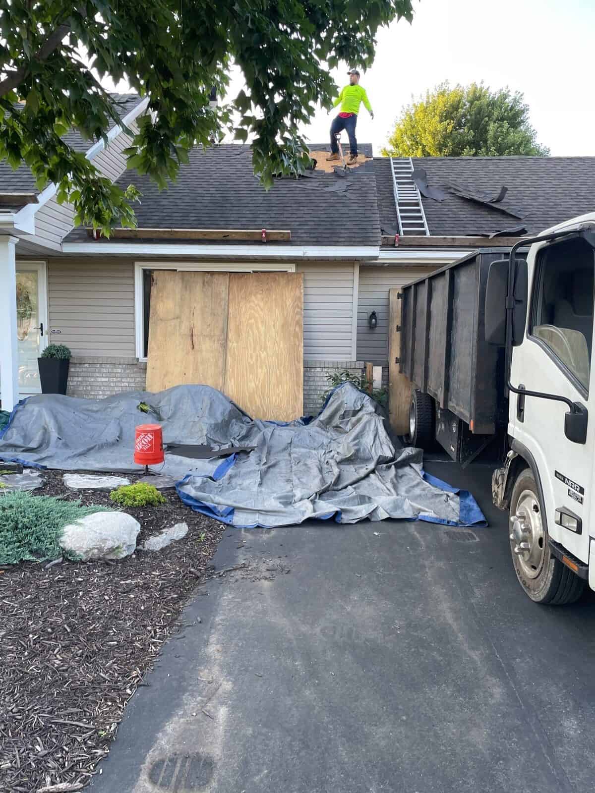 Tear-off debris handled with a dump trailer at an Andover, MN roof replacement