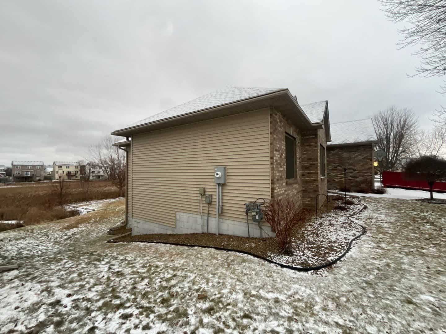 Osseo, MN home before its exterior restoration with original siding and roof