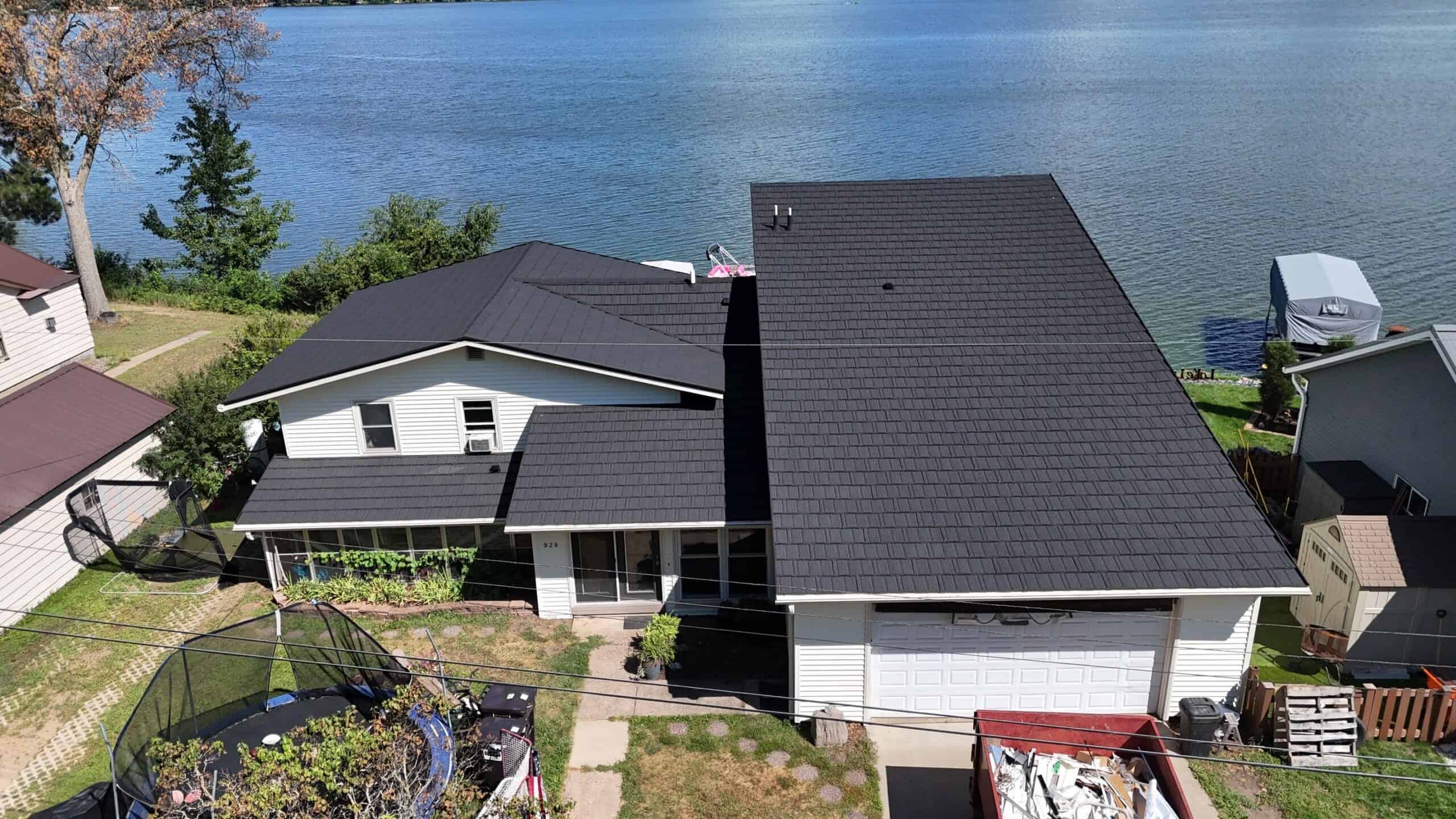 Altoona, WI home with a new Unified Steel Pine-Crest Shake roof in Charcoal and Norandex Cedar Knolls siding in Beige