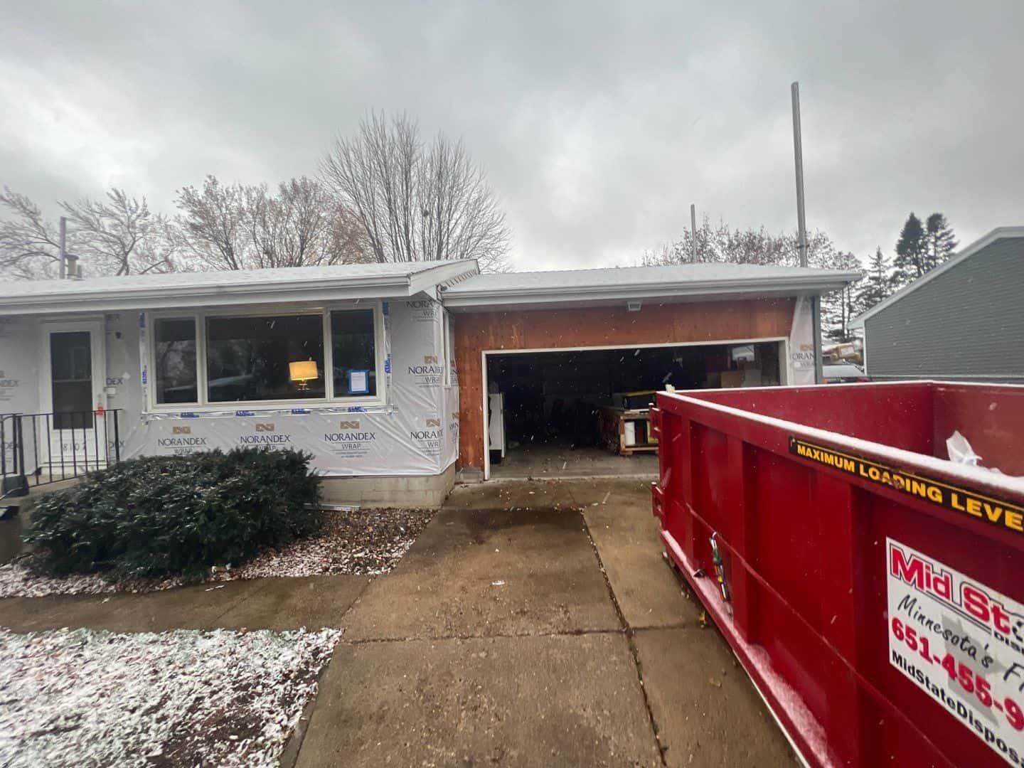 Mid-install with new housewrap up on a Crystal, MN home