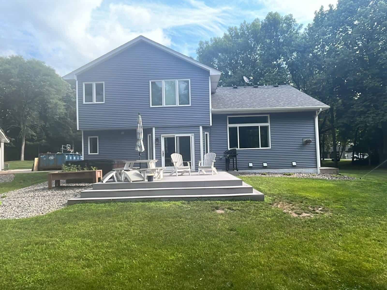 Back of an Annandale, MN home with new Flagstone siding and deck