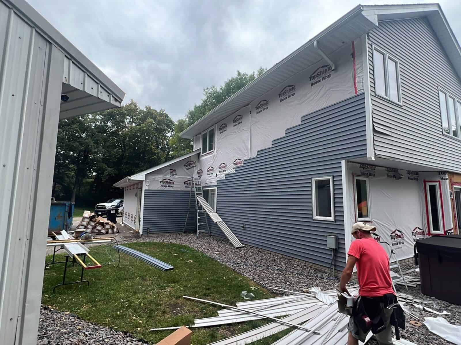 Crew installing new vinyl siding on an Annandale, MN home