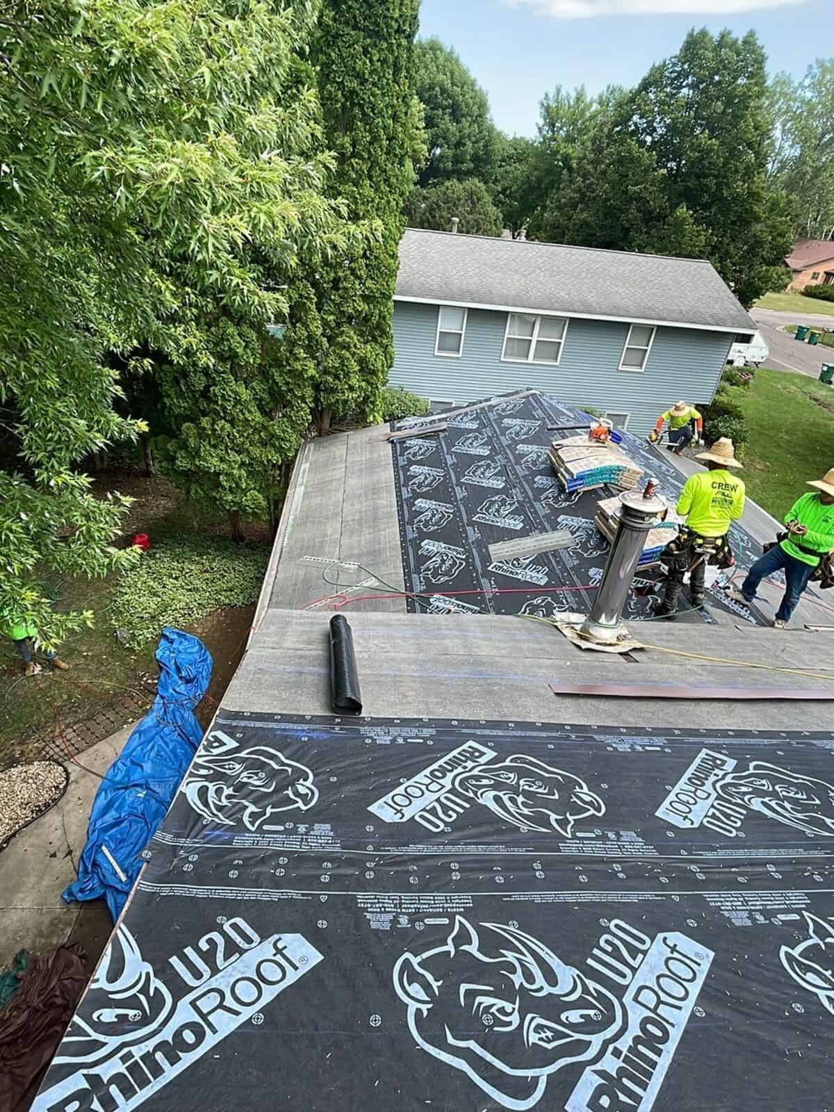 Crew installing new roofing underlayment on a Little Canada, MN home