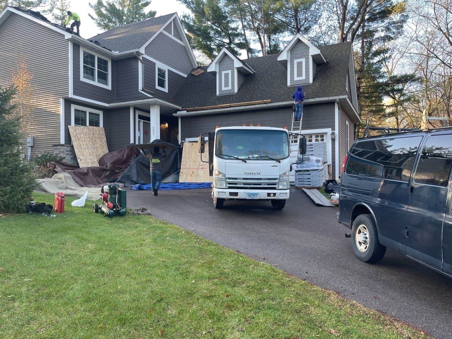 Install day for a Tamko Heritage roof in Weathered Wood on a Chanhassen, MN home