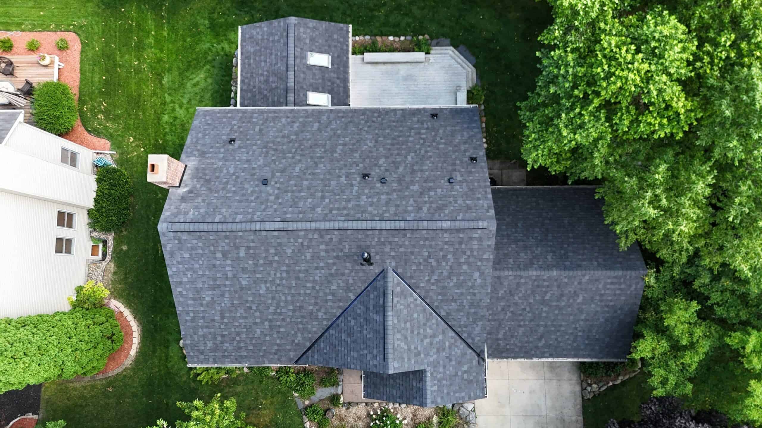 Aerial view of a completed large shingle roof in Eden Prairie