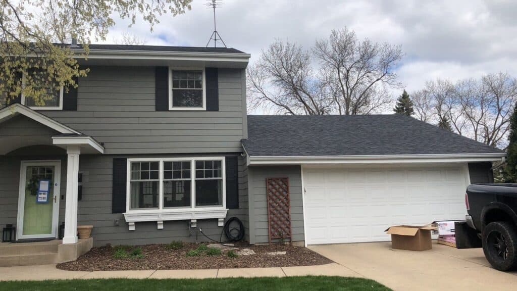 Completed hail damage roof replacement on an Edina home with Owens Corning Duration shingles in Onyx Black