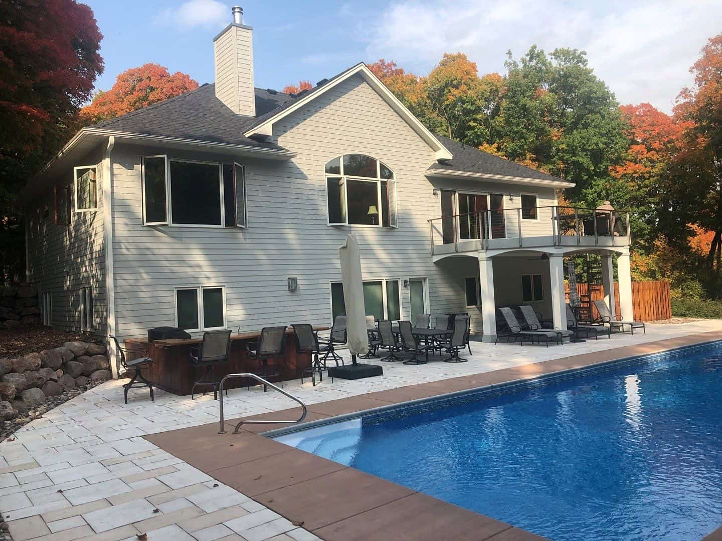 New GAF Timberline HDZ roof in Charcoal and pool at the rear of a Rockford, MN home