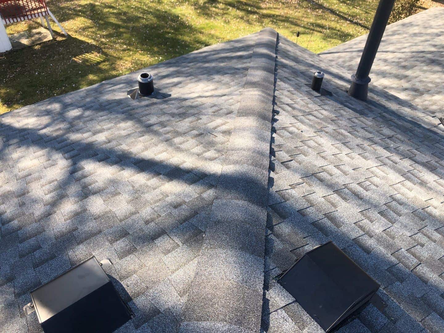 Finished Pewter Gray roof with black vents and flashing details