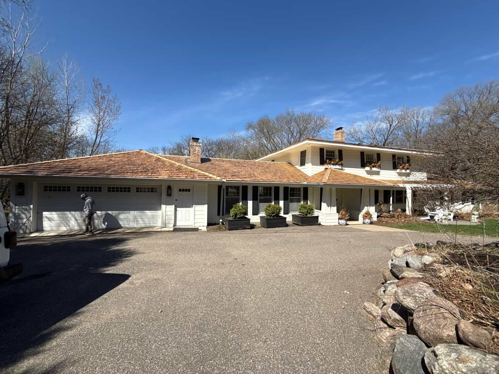 Finished cedar shake roof replacement on a Wayzata home by First Impressions Exteriors