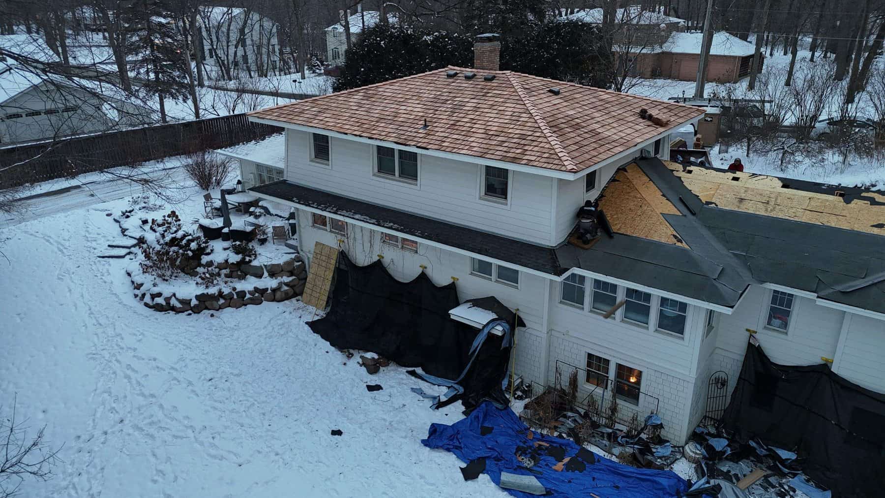 New cedar shake roof installation in progress on a Wayzata, MN home